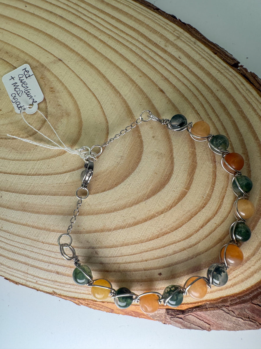 Bracelet with multicolored beads on a wooden surface