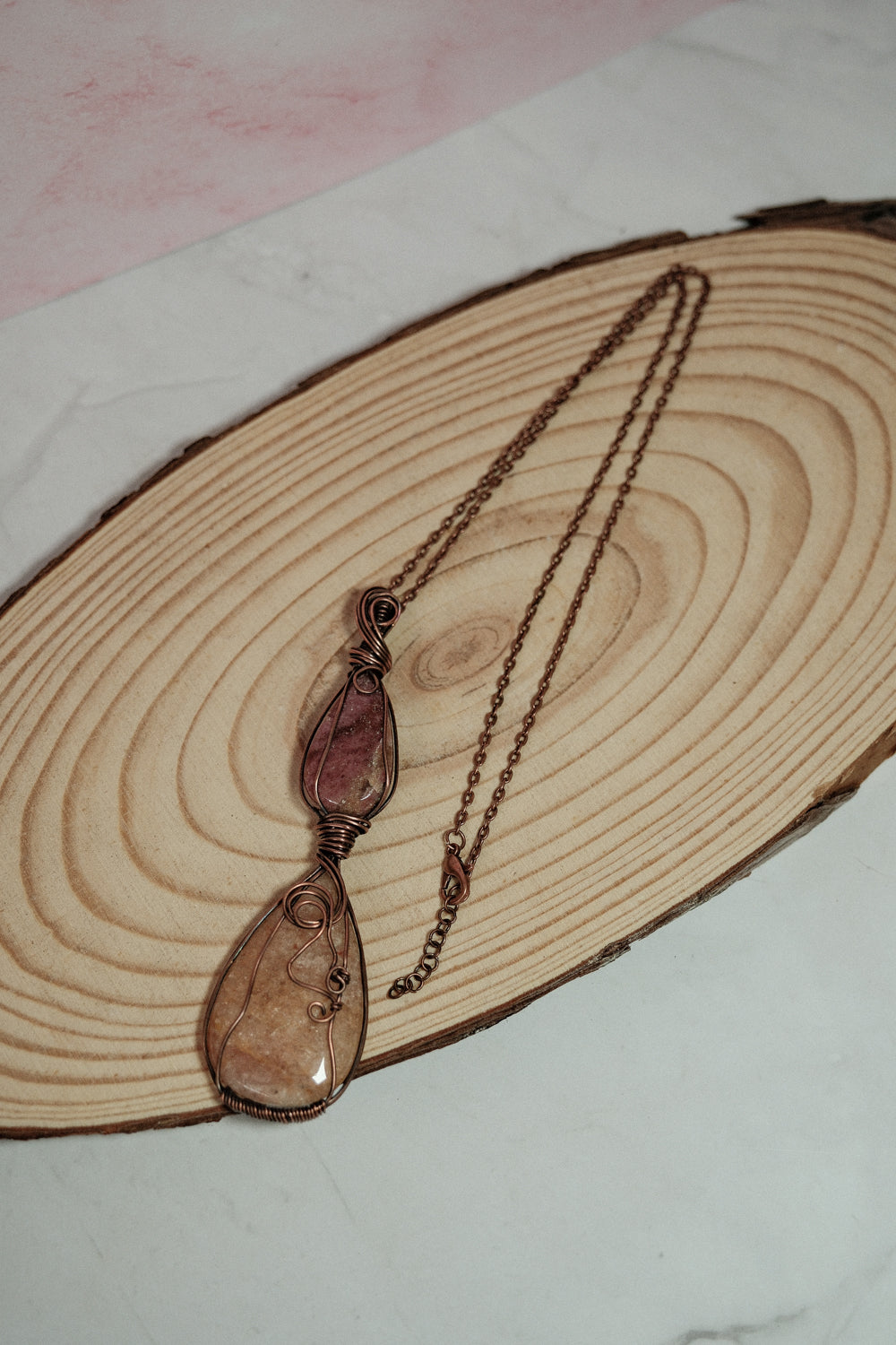 Necklace with a pendant on a wooden surface