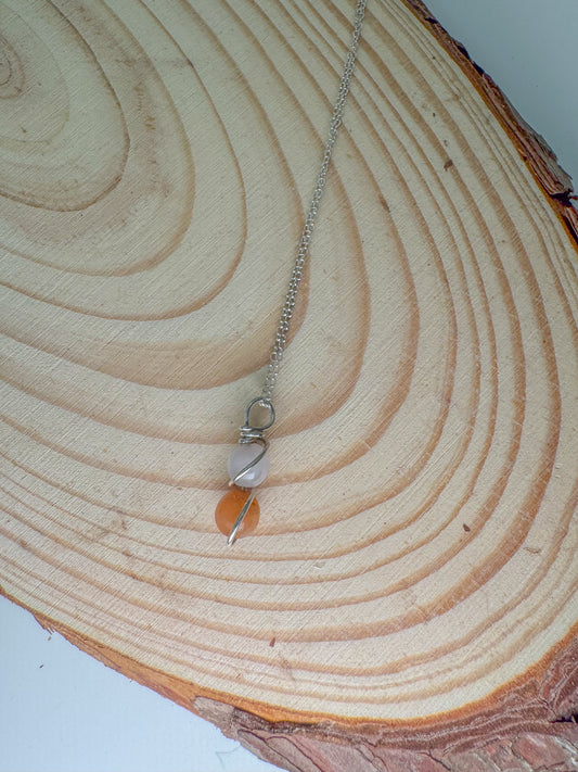 Necklace with a pendant on a wooden surface